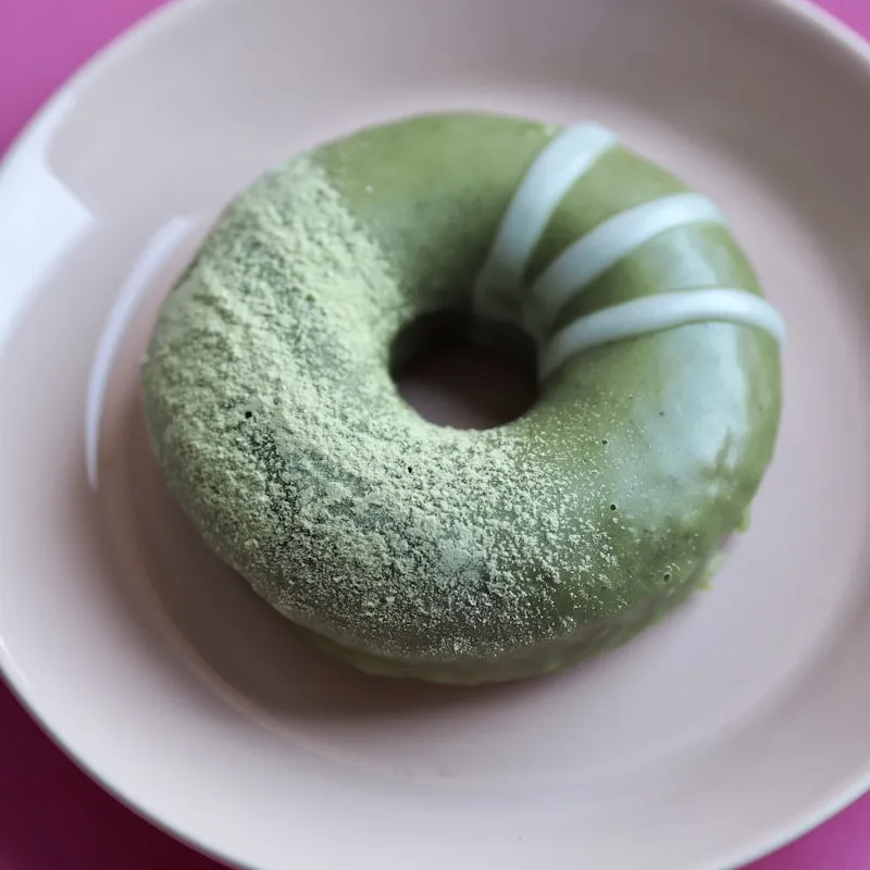 Mini crispy donut dipped in fragrant pandan dip